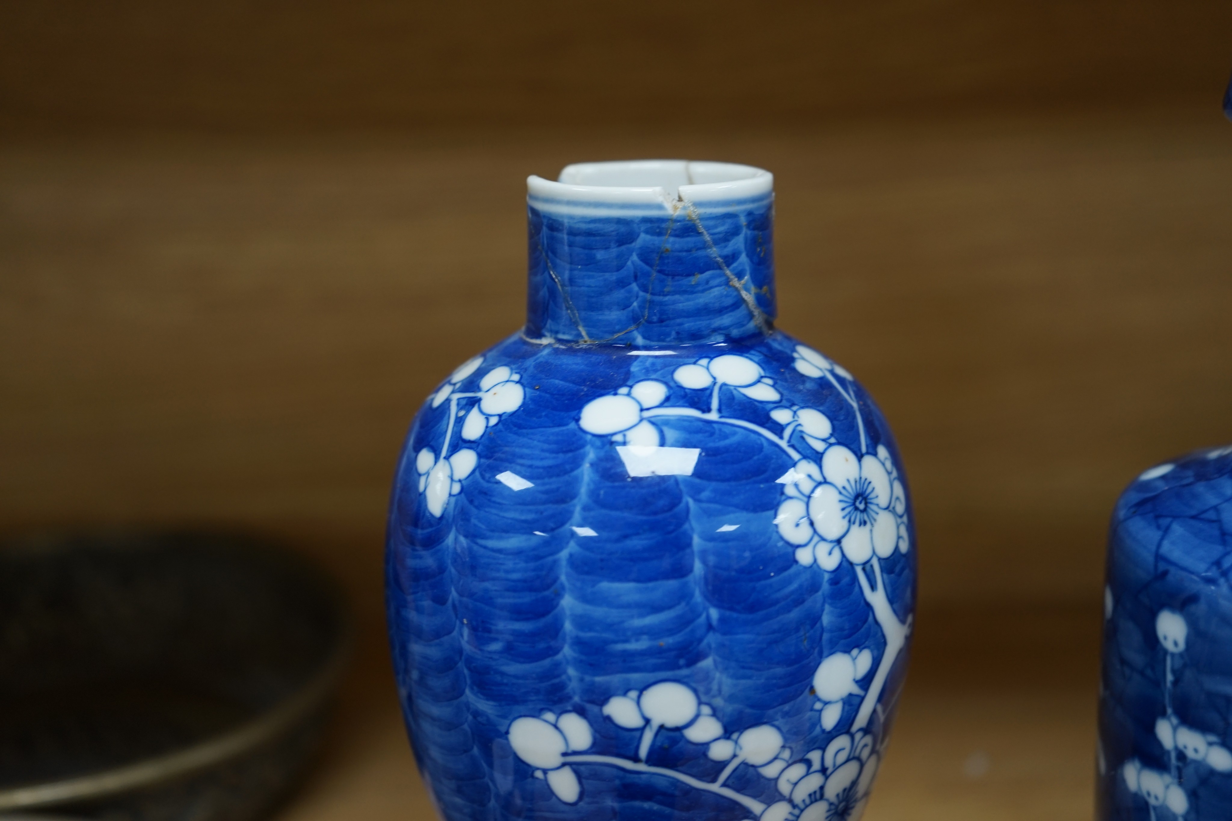 Three Chinese blue and white prunus vases. 25.5cm